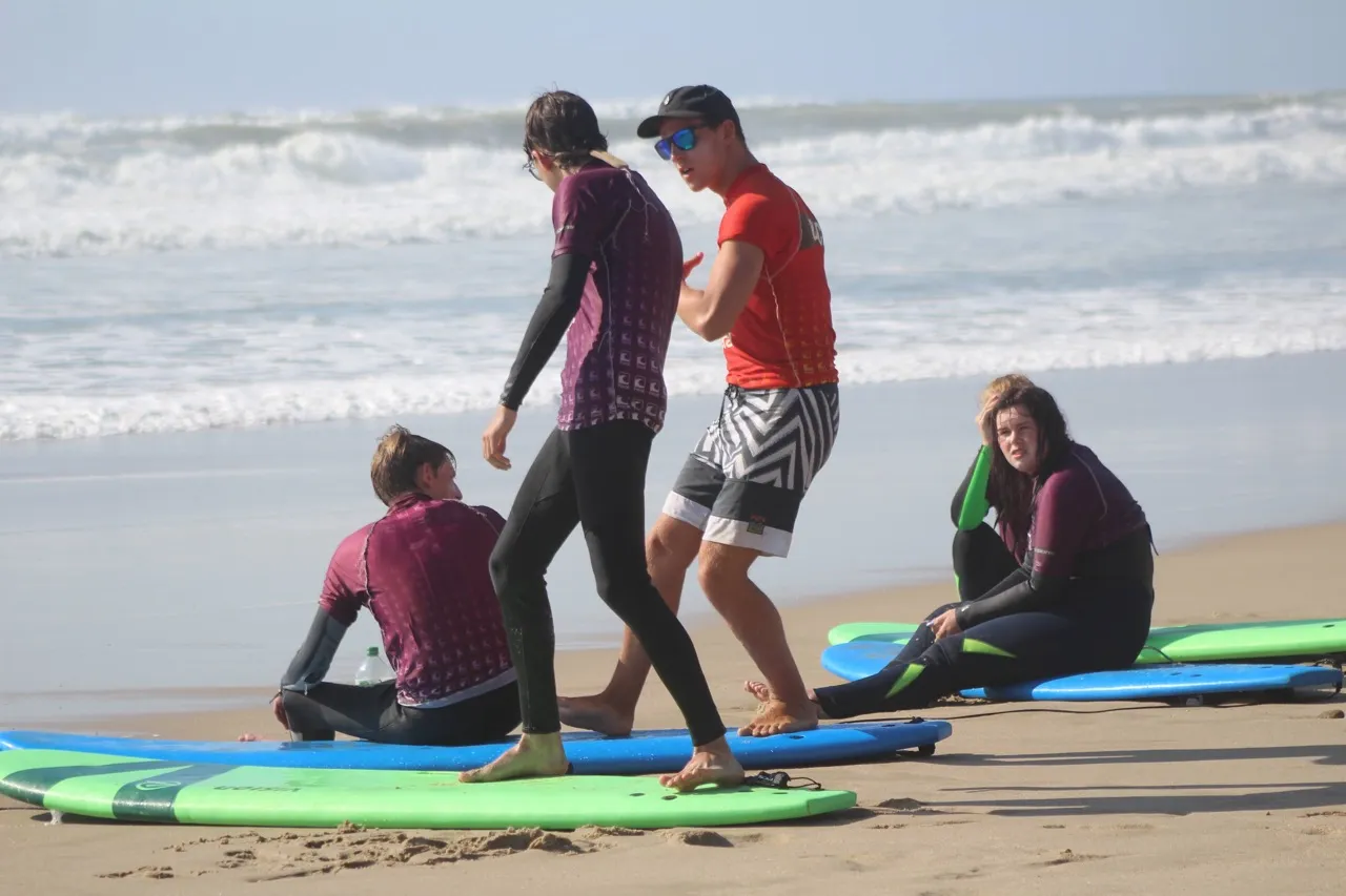 Ben coaching a surfer through some stretches