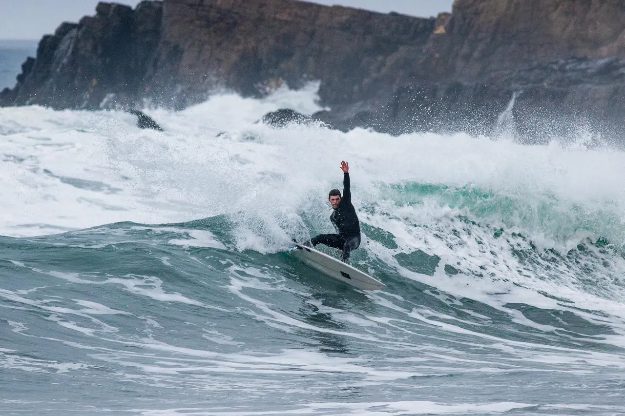 Ben performing a high level top turn